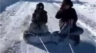 Lastiği kızak yapıp araçla çektiler: Çocukların kar eğlencesi kameralara yansıdı