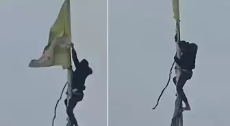 Suriye'de halk, terör örgütü sembollerini yırtarak indirdi