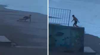 Sahilde şınav çekerken 2 metrelik dalgaları görünce koşarak kaçtı
