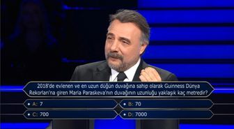 2018'de evlenen ve en uzun düğün duvağına sahip olarak Guinness Dünya Rekorları'na giren Maria Paraskeva'nın duvağının uzunluğu yaklaşık kaç metredir?