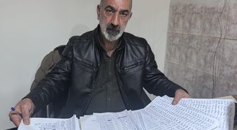 Diyarbakır'da muhtar hayırseverlerden gelen yardımları ihtiyaç sahiplerine ulaştırıyor