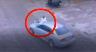 Otomobilin kaputunda yolcu taşıyan sürücüye ceza; o anlar kamerada
