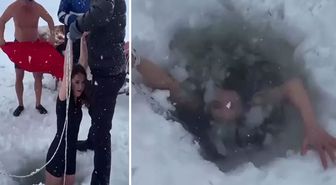 Kars'ta bir kadın Çıldır Gölü'nün buz gibi suyuna girdi