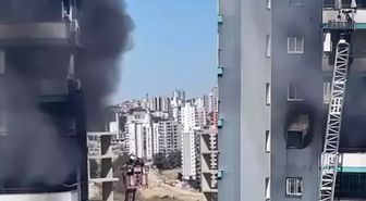 Apartmanda çıkan yangında mahsur kalan baba ve bebeğini inşaat işçisi kurtardı