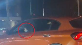 Kucağındaki çocukla otomobiliyle trafikte ilerledi