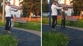 Parkta çocuğa oyuncak silahla atış talimi yaptırdı