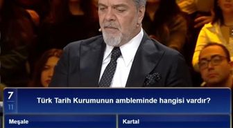 Türk Tarih Kurumunun ambleminde hangisi vardır? Türk Tarih Kurumunun ambleminde meşale, defne yaprağı, kitap, kartal var mı?