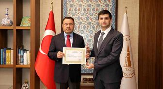 Vali Işın'dan Kaymakam Teltik'e başarı belgesi