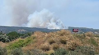İzmir'de çöplükten makilik alana sıçrayan yangına müdahale ediliyor