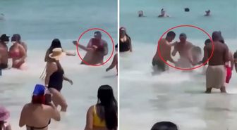 Sahilde eşine acımasızca saldıran adamı çevredekiler darp etti