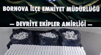 İzmir'de polisten kaçan şüphelinin terk ettiği otomobilde 118 bin sentetik hap ele geçirildi