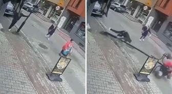 Telefonla konuşurken yaslandığı sokak lambası bir kadının üzerine devrildi