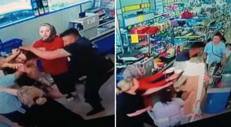 Markette kadını saçlarından tutup yerde yumrukladı! Yaptığı yanına kalmadı