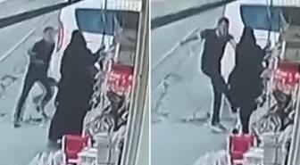 Sokak ortasında eşine tekme ve yumrukla saldırdı