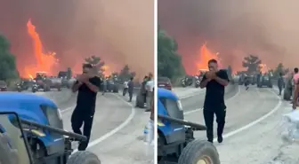 Alevlerin ortasında tepki çeken görüntüler! Orman kül olurken, o sigara yaktı