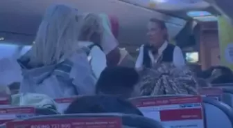 Uçağın tekeri piste değdiği gibi ayağa kalktılar, kabin memurları polis çağırdı