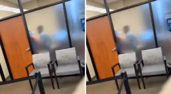 İki banka çalışanı, müşterilerin kendilerini görmediğini sanıp buzlu cam arkasında ilişkiye girdi
