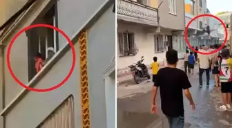Yangında nefes kesen anlar! Önce çocuğunu attı, ardından kendisi atladı