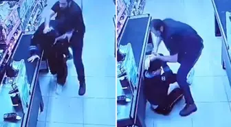 Oğlunu darbettiğini öne sürdüğü market çalışanını yumruklayıp tekmeledi