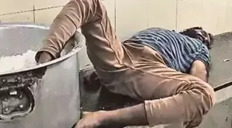 Öğrenci yurdunda çalışan sarhoş bekçi ayağı pirinç kazanı içinde uyurken yakalandı