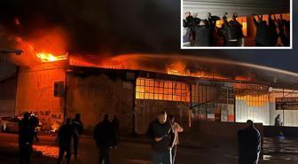 Alevlere teslim olan iş yerlerindeki araçları kurtarmak için zamanla yarıştılar