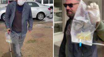 Sonda tüpüne meyve suyu koyup dilencilik yapan şahıs yakalandı