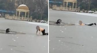 Kahramana adam, buzlu göle düşen çocuğu kurtardı