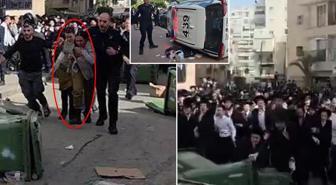 İsrail fena karıştı! 2 kadın polisi kalabalık Haredi grubun elinden zor aldılar