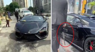 Kendi memleketinde silahlı korumalarla geziyor