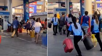 Tayland'da yakıt krizi nedeniyle insanlar ellerinde bidonlarla petrollere akın etti