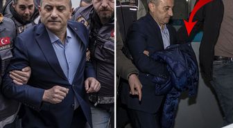 Tuncay Sonel, cezaevine götürülürken ellerini montuyla kapattı