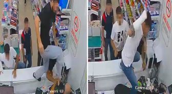 Kırtasiyeyi bastılar, sahibine tekme tokat saldırdılar