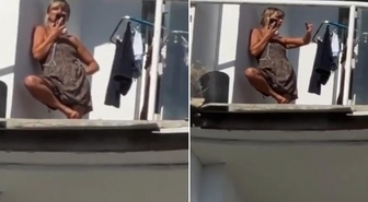 Bina bombaların hedefi oldu, genç kadın hiçbir şey olmamış gibi davrandı