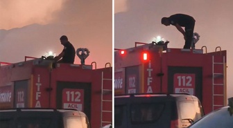 Yangını söndürdü, vakit daralınca itfaiye aracının üstünde namaz kıldı