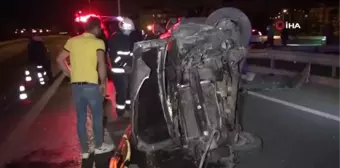 Takla atıp ters dönen otomobilde yaralanan 2 kişiyi itfaiye ekipleri kurtardı