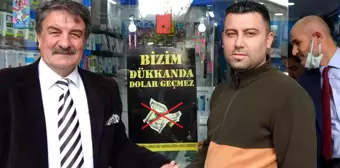 Pendik'te kapı kapı dolaşan grup, esnafı doları boykot etmeye davet etti