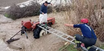 Taşan derede traktörle geçerken mahsur kaldı