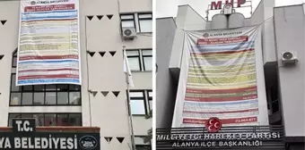 CHP'nin belediye binasına astığı borç afişine MHP'den alacak afişli cevap