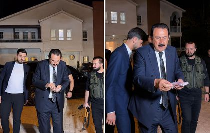 Ertoşi aşiretinin lideri İskender Ertuş aracından iner inmez deste deste para dağıttı