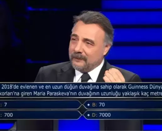 >2018'de evlenen ve en uzun düğün duvağına sahip olarak Guinness Dünya Rekorları'na giren Maria Paraskeva'nın duvağının uzunluğu yaklaşık kaç metredir?