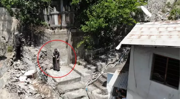 The 75-year-old woman is left alone in the big village with no one around! She doesn't even have a path to walk on.