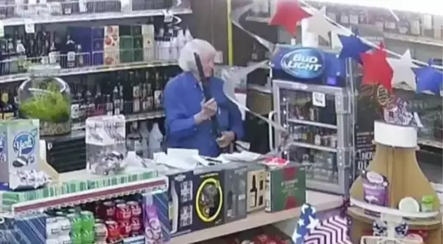 The 80-year-old grocer repelled the armed attacker with his hunting rifle.