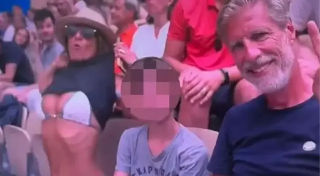 During a tennis match at the 2024 Paris Olympics, a woman spectator showed her breasts to the camera in front of her husband and child.