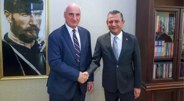CHP leader Özel posed with the Greek ambassador in front of an Atatürk portrait during his visit.