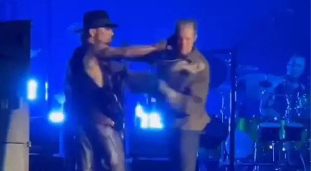 The rock band's lead singer punched the guitarist on stage, and the concert came to an end.