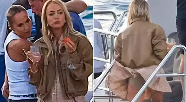 Famous radio host Jackie 'O' Henderson was caught off guard by the wind while having fun on a yacht with her friends.