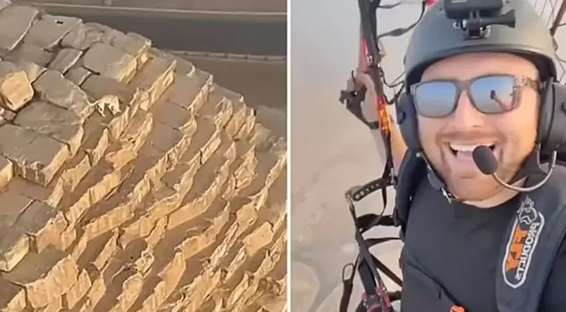 The paraglider saw a dog wandering at the top of the Giza Pyramid.