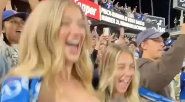 Two women drew attention by showing their breasts to the cameras during a baseball game.