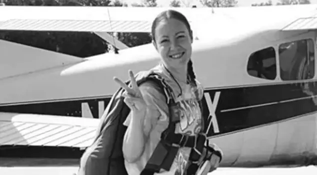 A woman who was struck by an airplane propeller while taking a photograph has lost her life.