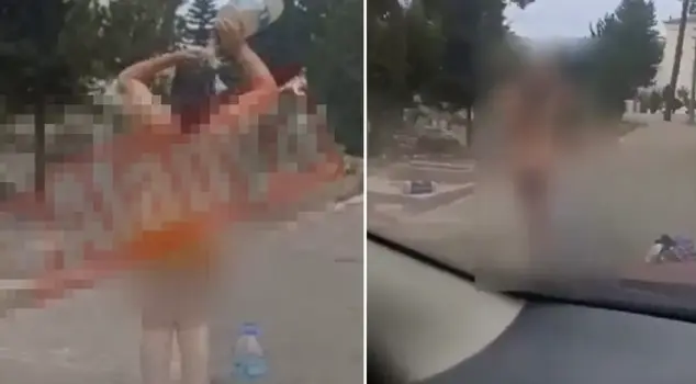 В кладбище была замечена женщина, принимающая душ нагишом.
